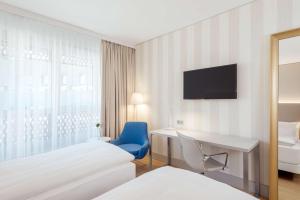 Voodi või voodid majutusasutuse NH Graz City toas