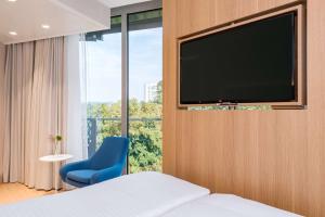 Televiisor ja/või meelelahutuskeskus majutusasutuses NH Graz City