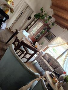 a living room with two chairs and a couch at Affittacamere Paradiso, turismo rurale e bontà in Tempio Pausania