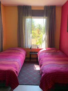 Katil atau katil-katil dalam bilik di Cozy house in the middle of nature