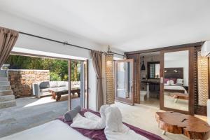 a living room with a couch and a table at Can Ribes Ibiza in Illes Balears