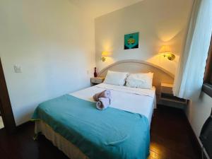 Katil atau katil-katil dalam bilik di Vale Azul Apartamento em Gramado!
