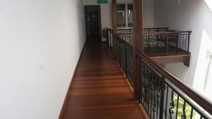 a hallway with a stairway leading to a building at Heeren Straits Hotel in Malacca