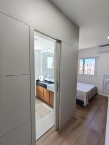 a bathroom with a sink and a mirror at Studio SUPER LUXO a 5 min do Nubank Parque in São Paulo +36 photos