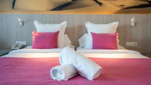 a hotel room with two beds with pillows at Labranda Marieta & Spa - Adults Only in Playa del Ingles