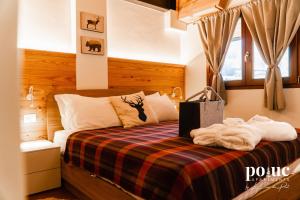 Postel nebo postele na pokoji v ubytování Petit Nid - Poluc Apartments bilocale