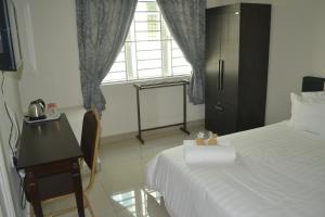 Postel nebo postele na pokoji v ubytování Hotel Mutiara KGMMB, Melaka