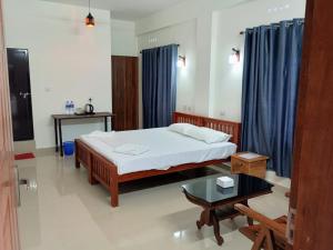 CHAEL Airport Residency,Nedumbassery Cochin客房内的一张或多张床位
