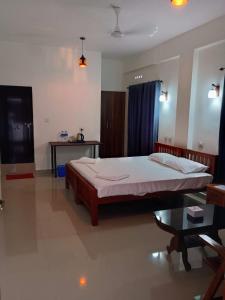CHAEL Airport Residency,Nedumbassery Cochin客房内的一张或多张床位