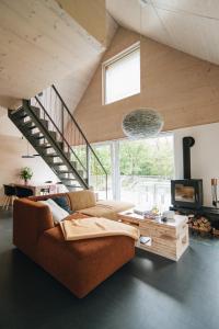 Posezení v ubytování Domesi Concept House Pulečný