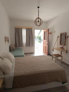 Postel nebo postele na pokoji v ubytování Athina Studio Apartments