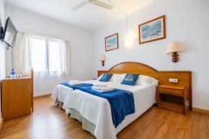 Posteľ alebo postele v izbe v ubytovaní Hostal Doris - Adults Only