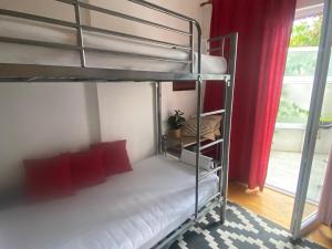 Postel nebo postele na pokoji v ubytování Apartmani Smiljana