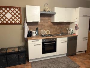 Kuchyň nebo kuchyňský kout v ubytování Miniferienwohnung für unkompliziertes Naturliebhaberpärchen