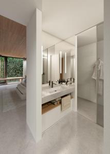 a bathroom with two sinks and a large mirror at CASA ROMA Hostel Boutique in Tarragona