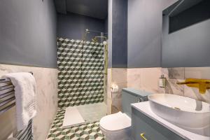 a bathroom with a sink and a toilet and a shower at Harrogate by Deuce Hotels in Harrogate