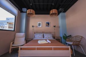 Letto o letti in una camera di 小島月光民宿 Moonlit Isle