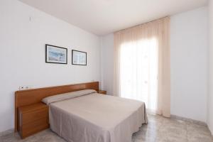 Posteľ alebo postele v izbe v ubytovaní Rentalmar Aventura