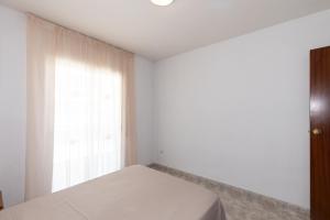 Posteľ alebo postele v izbe v ubytovaní Rentalmar Aventura