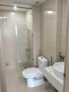 a bathroom with a toilet and a shower and a sink at Nothingness House in Thôn Văn Dương +10 photos