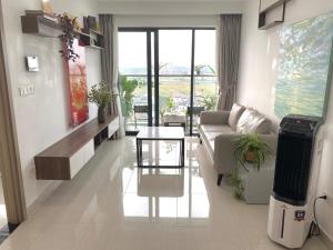 a living room with a couch and a table at Nothingness House in Thôn Văn Dương