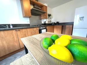 a bowl of fruit on a table in a kitchen at Alma House by Blue Skies Stays in Hartlepool
