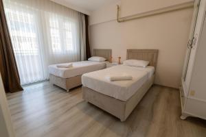 Ένα ή περισσότερα κρεβάτια σε δωμάτιο στο Belya Apart Hotel