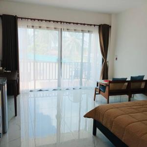 Ένα ή περισσότερα κρεβάτια σε δωμάτιο στο First Light sunset view bungalow +4 φωτογραφίες