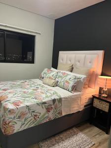 a bed in a bedroom with a window and a bed sidx sidx sidx at Casa do Dylan in Khomas Region