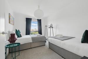 Ένα ή περισσότερα κρεβάτια σε δωμάτιο στο Central Belfast Apartments Sandford +32 φωτογραφίες