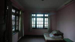 Letto o letti in una camera di Nagarjun Home Stay