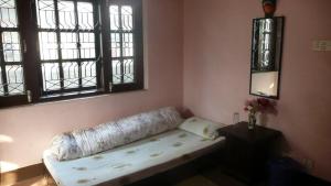 Letto o letti in una camera di Nagarjun Home Stay