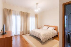 Postel nebo postele na pokoji v ubytování Quinta dos Arcos