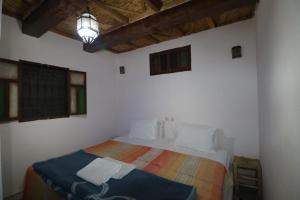 Postel nebo postele na pokoji v ubytování Gîte Imsker Elbour