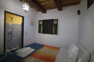 Postel nebo postele na pokoji v ubytování Gîte Imsker Elbour