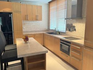 A kitchen or kitchenette at Bright beachfront retreat in Bang Tao