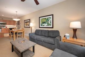 a living room with a couch and a table at Fraser Crossing 3227 Ski In Ski Out Winter Park Resort in Winter Park