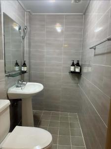a bathroom with a sink and a toilet and a shower at Dada House in Seoul +67 photos