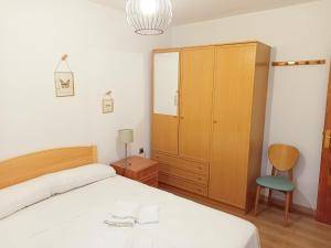 Postel nebo postele na pokoji v ubytování Apartamentos Valle de Tena - Biescas 3000