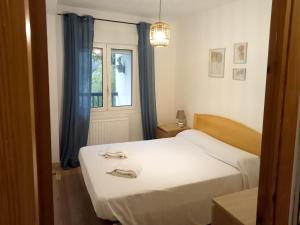 Postel nebo postele na pokoji v ubytování Apartamentos Valle de Tena - Biescas 3000