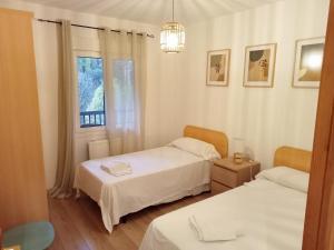 Postel nebo postele na pokoji v ubytování Apartamentos Valle de Tena - Biescas 3000