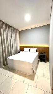 Postel nebo postele na pokoji v ubytování HOTEL DEL REY CURITIBA by POTY - NA FAMOSA RUA XV DE NOVEMBRO