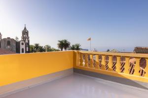 a yellow railing on the roof of a building at E4 - Estudio La Orotava in La Orotava