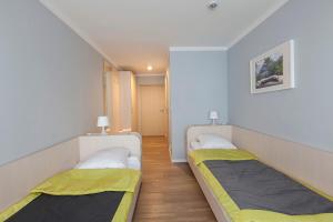 Postel nebo postele na pokoji v ubytování Inwest Ośrodek Szkoleniowo-Wypoczynkowy