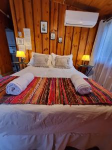 Postel nebo postele na pokoji v ubytování Cabañas Carolín Cacao Castaño