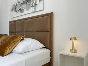 Posteľ alebo postele v izbe v ubytovaní Apartments - Villa Sabrina