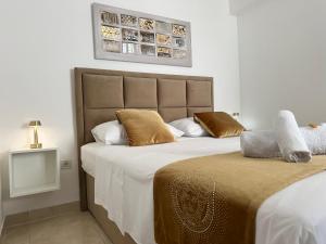 Posteľ alebo postele v izbe v ubytovaní Apartments - Villa Sabrina