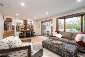 a living room with a couch and a table at Creekside Lodge in Minnetonka