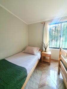 Postel nebo postele na pokoji v ubytování Nido Del Bosque