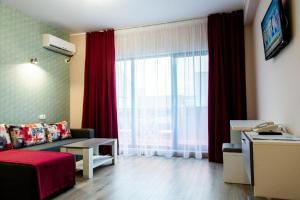 TV a/nebo společenská místnost v ubytování Friday Hotel